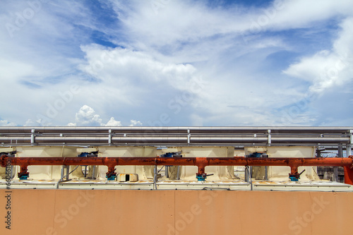 Industrial air conditioner on the roof with blue sky