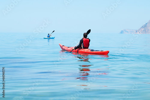 Kayak. People kayaking in the ocean. Active people. Sport photo