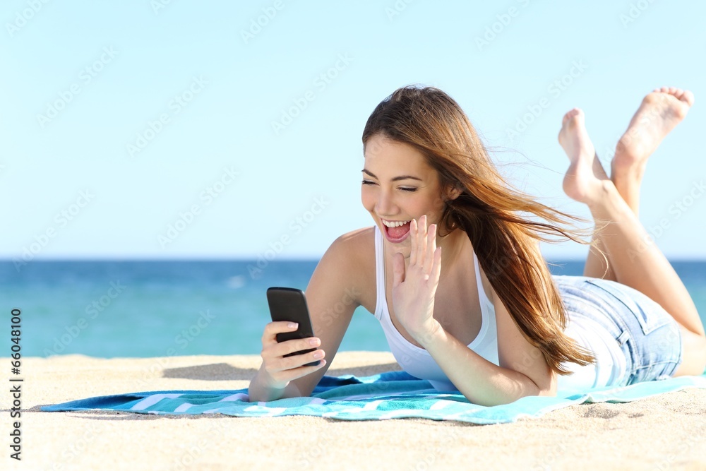 Teenager girl waving during a smart phone video call