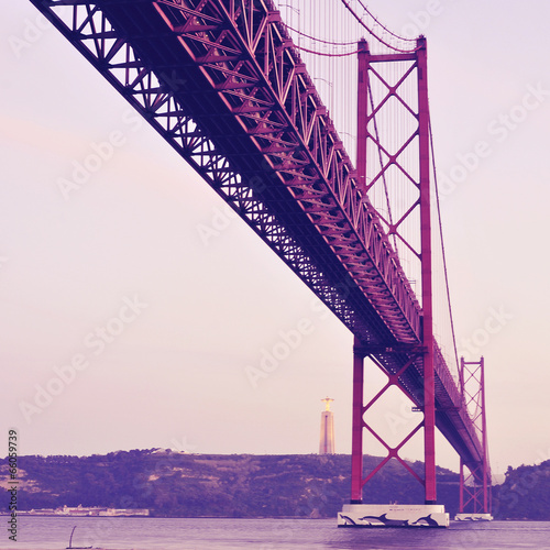 25 de Abril Bridge in Lisbon, Portugal, with a retro filter effe © nito