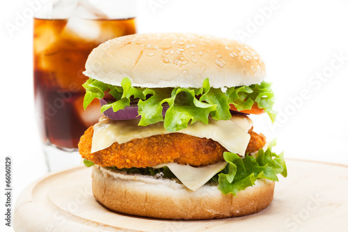 Chickenburger and glass of cola with ice