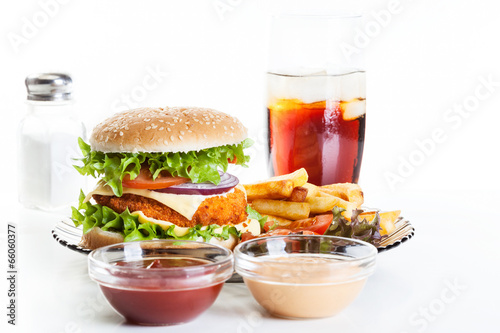 Chickenburger and glass of cola with ice