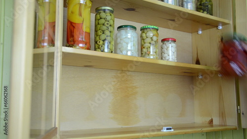 Wallpaper Mural hands take one after the other jars pickled vegetable winter use Torontodigital.ca