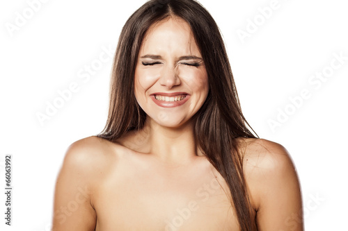 embarrassed young girl on white background