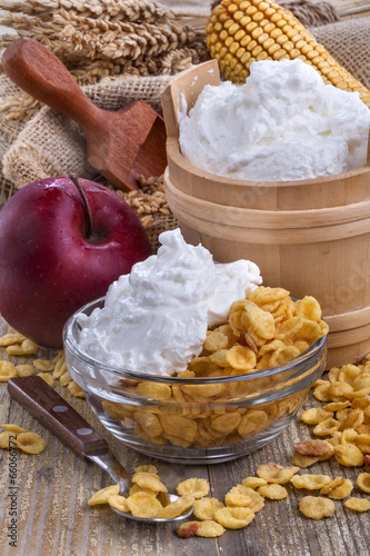 cornflakes with domestic sour cream on the table