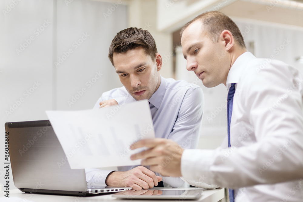 two businessmen having discussion in office