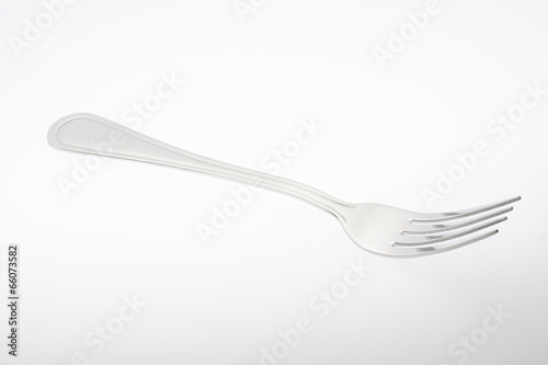 a silver fork isolated on gray background