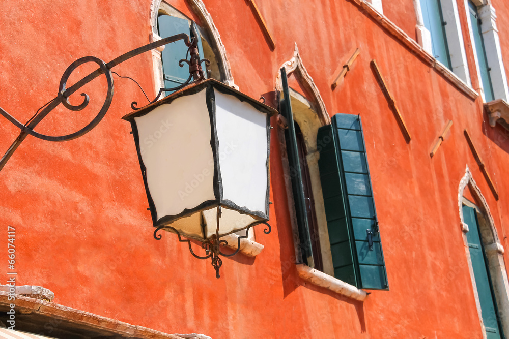 Lantern on the facade of old  italian house. Venice