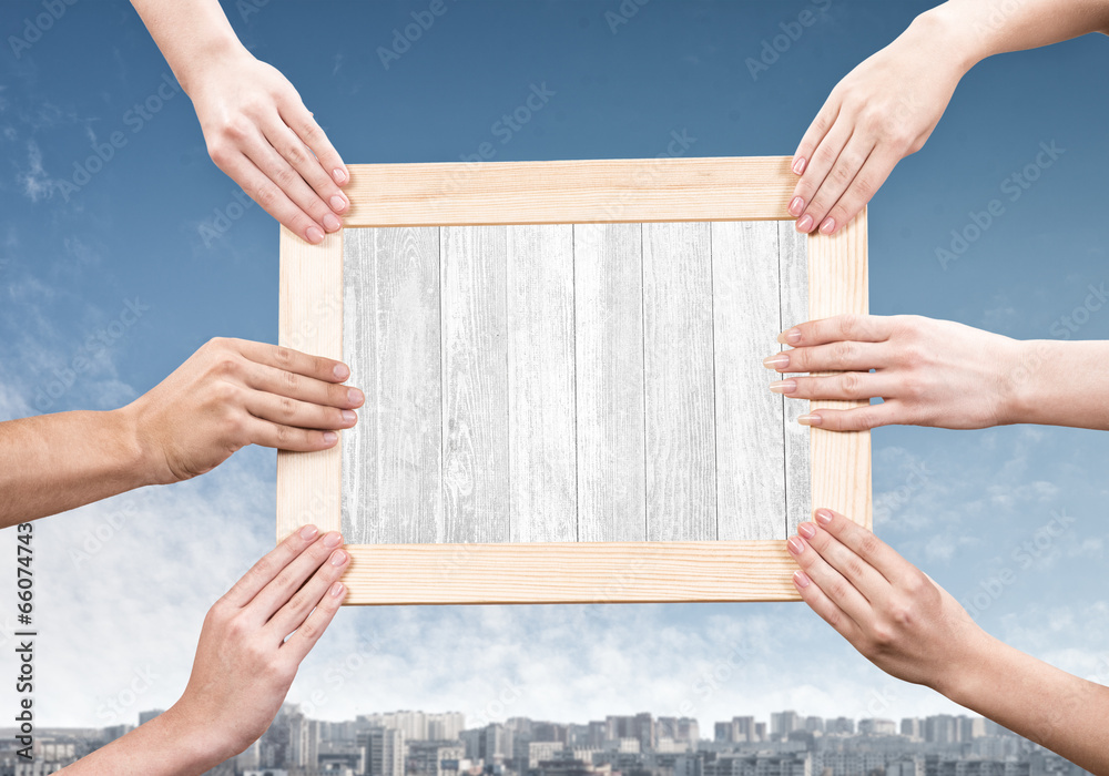 Hands holding frame Hands holding frame