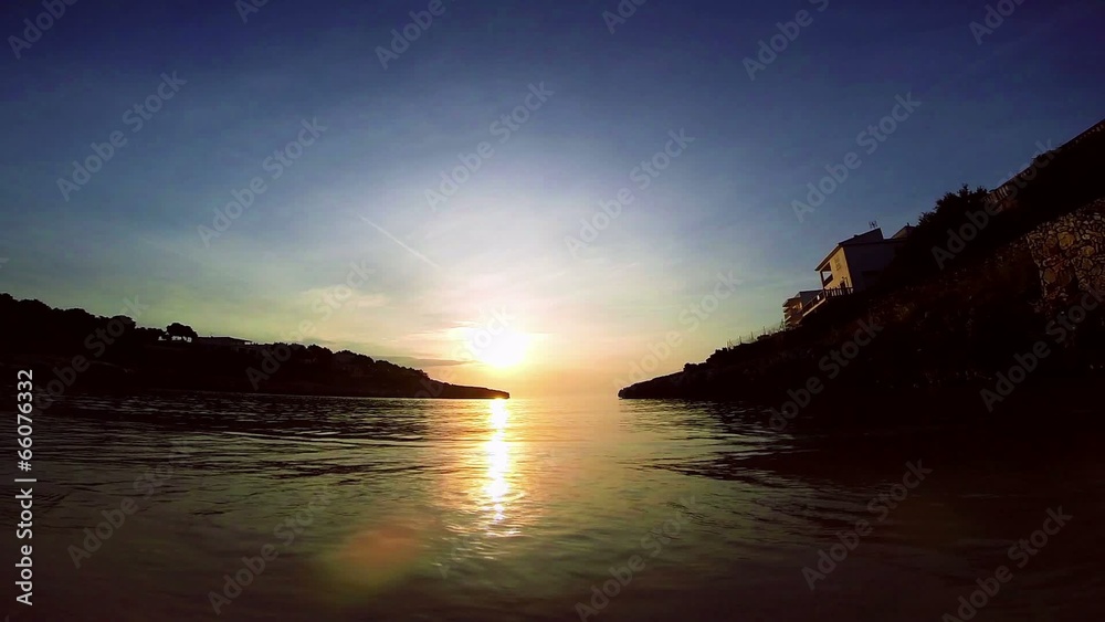 surf on the beach in the bay at sunset surf on the beach in the bay at sunset