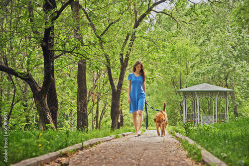 Girl walks with dog