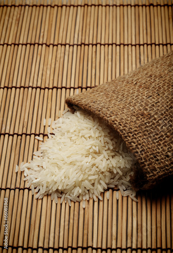 White uncooked rice in small sack
