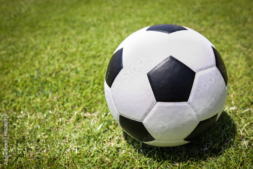 Soccer ball on green grass © powerbeephoto