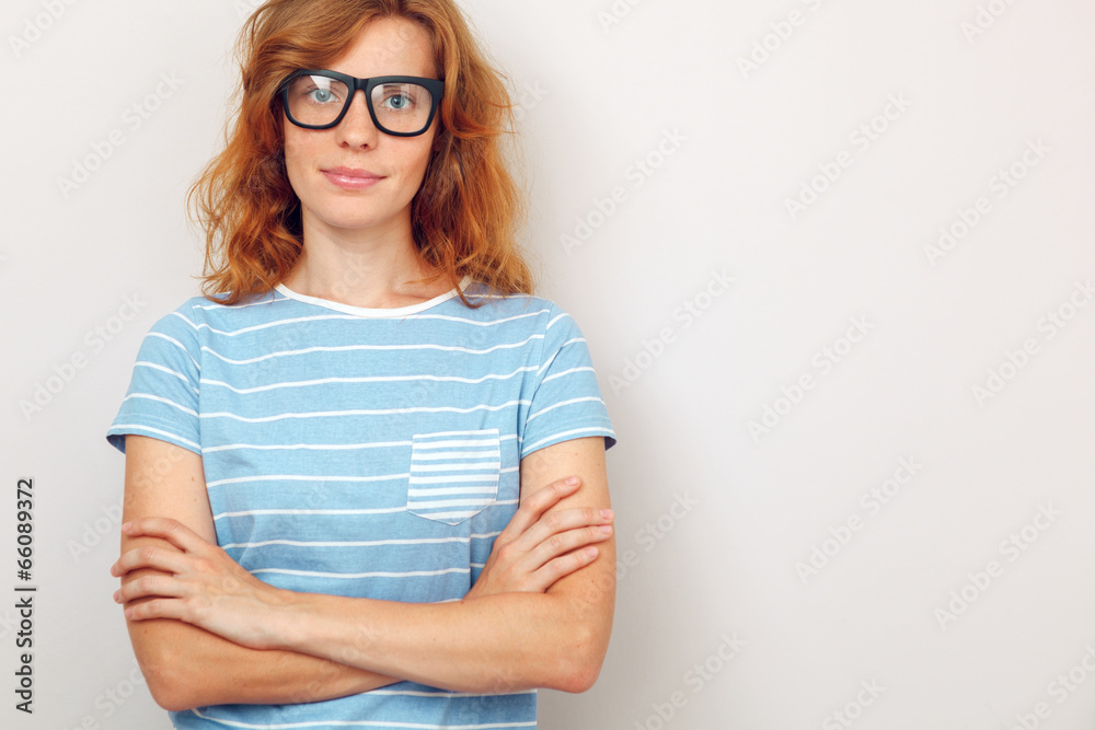 Portrait of young beautiful woman standing with crossed hands. Portrait of young beautiful woman standing with crossed hands.