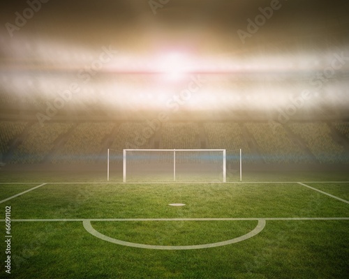 Football pitch with goalpost in stadium