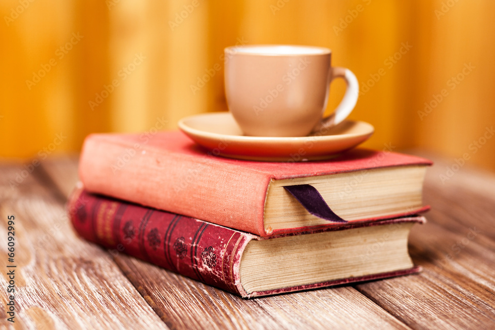 Naklejka premium Books and a coffee cup