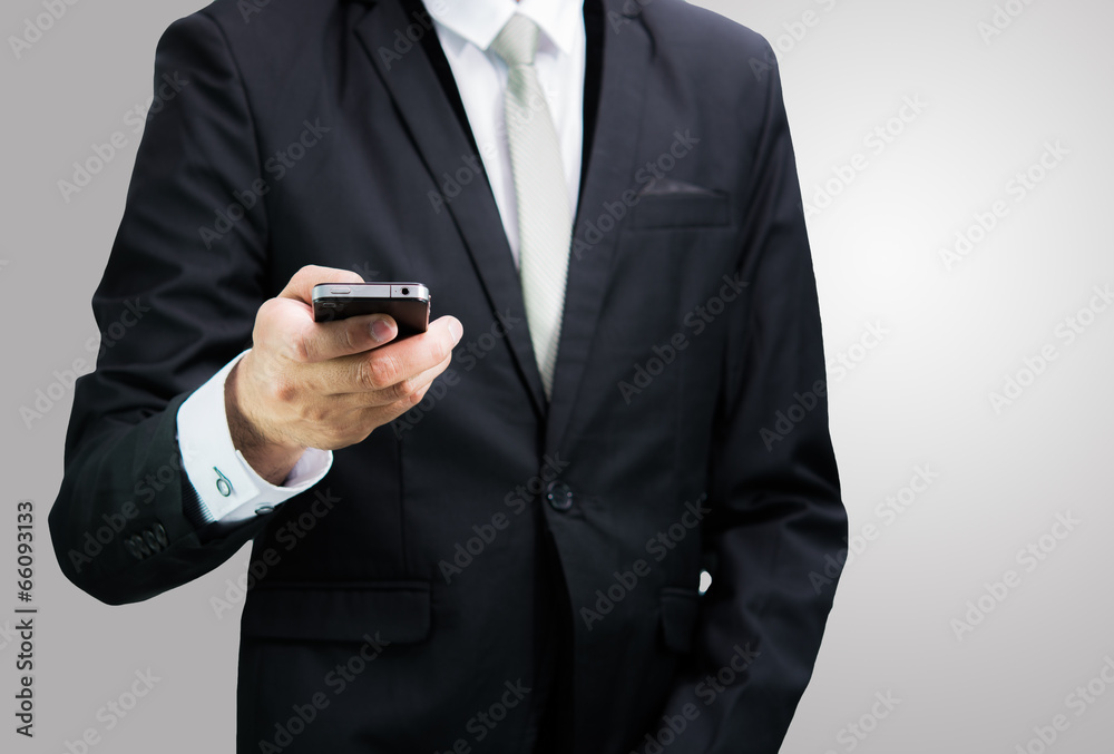 Businessman standing posture hand hold phone isolated Businessman standing posture hand hold phone isolated