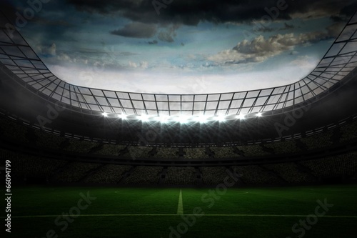 Large football stadium under blue sky #66094799