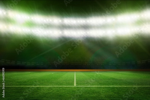 Football pitch under green lights