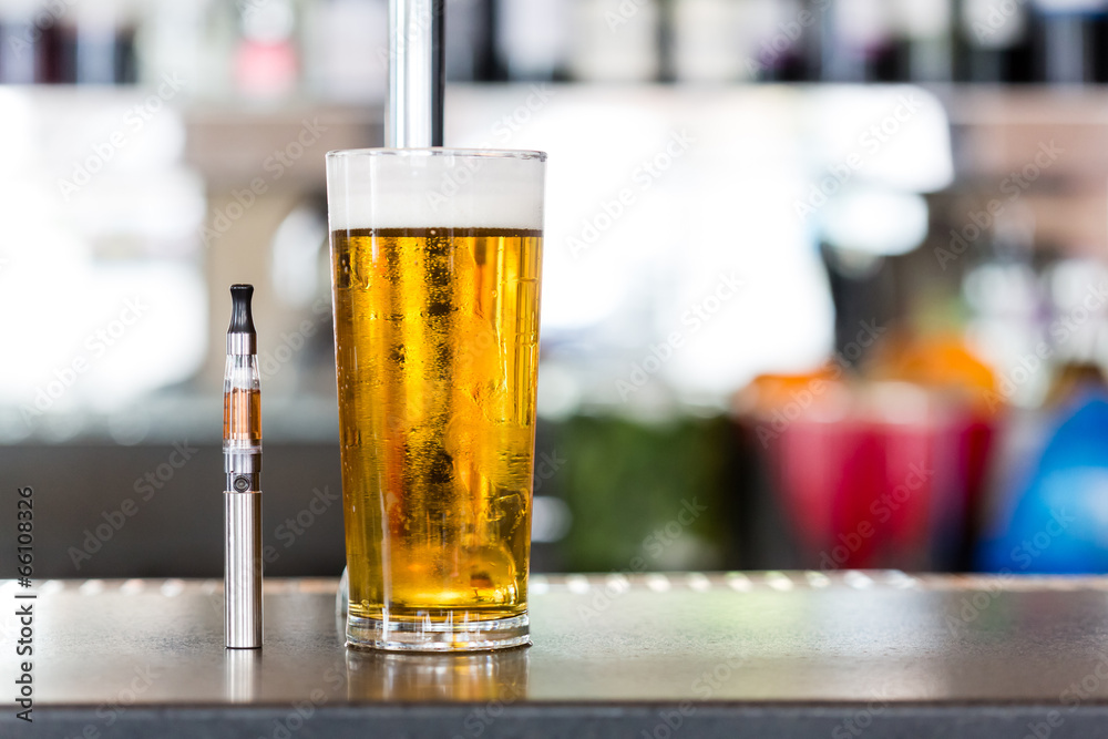 Vaporizer pipe and glass of beer Vaporizer pipe and glass of beer