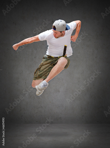 male dancer jumping in the air photo