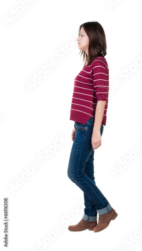 back view of walking woman in red sweater