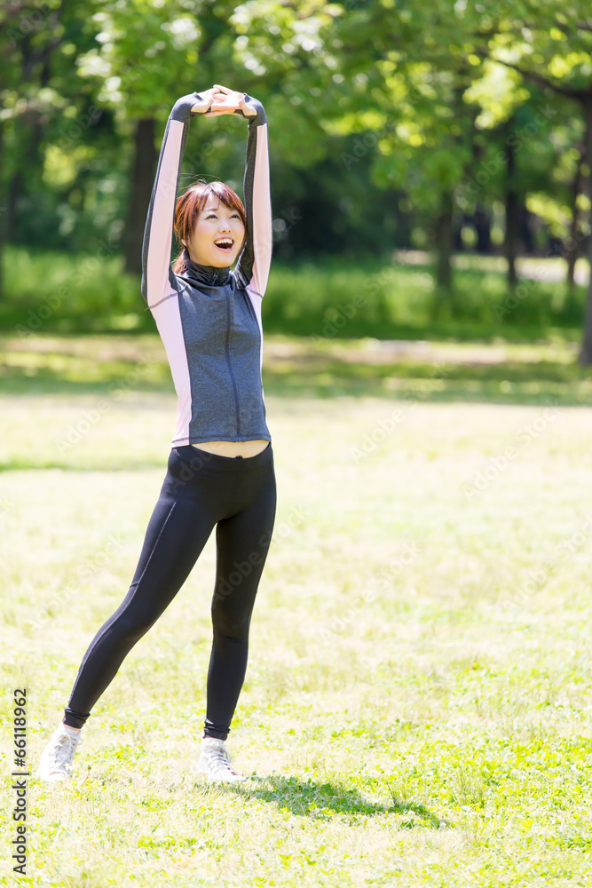 young asian woman exercising in the park young asian woman exercising in the park