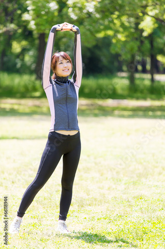 young asian woman exercising in the park