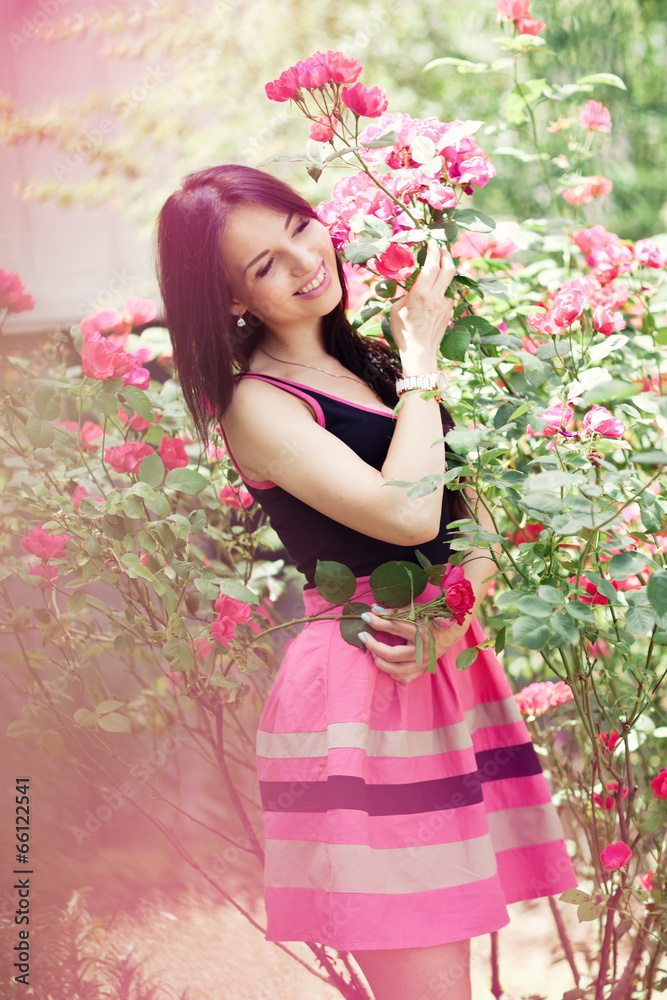 beautiful woman in garden with roses beautiful woman in garden with roses