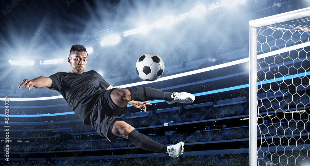 Hispanic Soccer Player kicking the ball - obrazy, fototapety, plakaty 