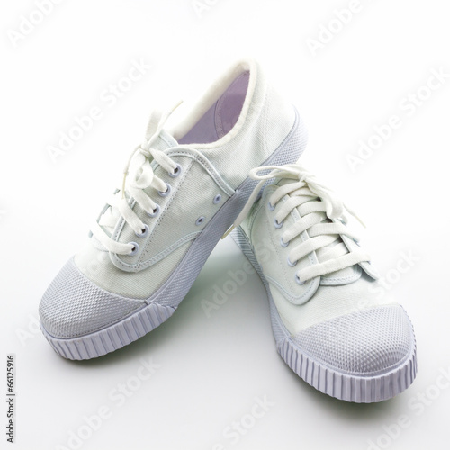 White sport shoes on white background.