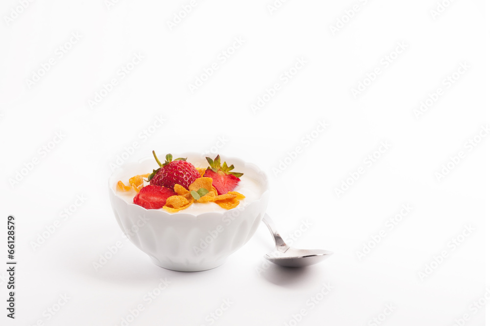 White yogurt with fresh strawberries and cornflakes White yogurt with fresh strawberries and cornflakes