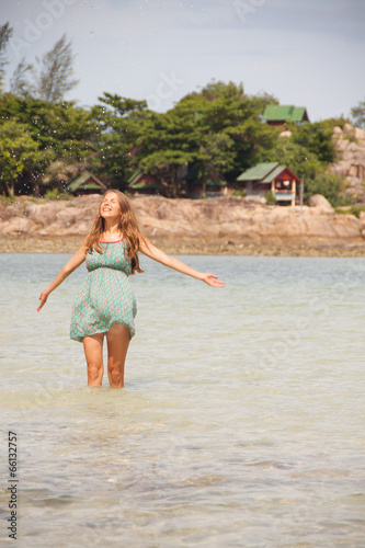 woman standing knee-deep in water