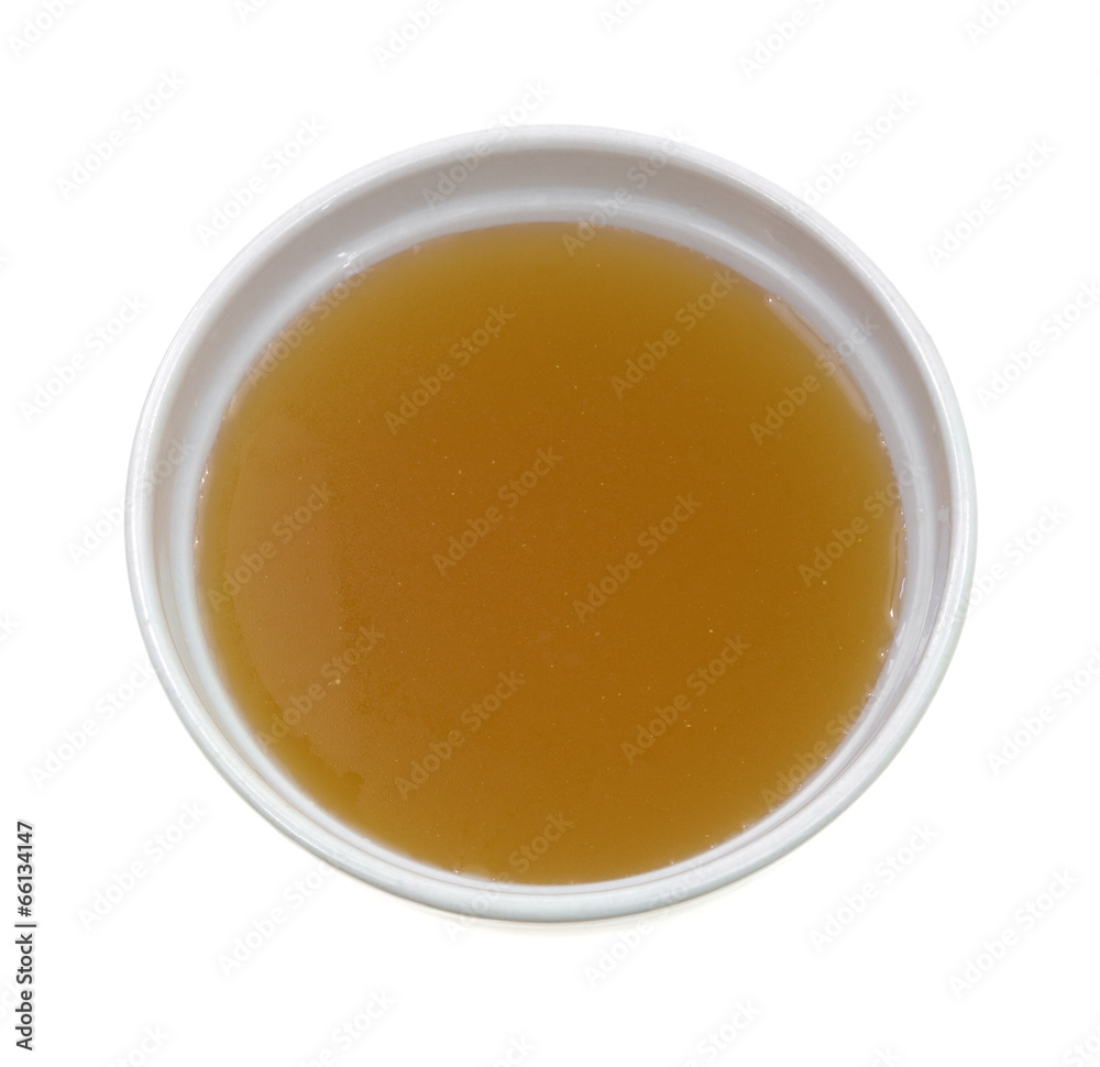 Chicken broth top view in bowl on a white background Chicken broth top view in bowl on a white background