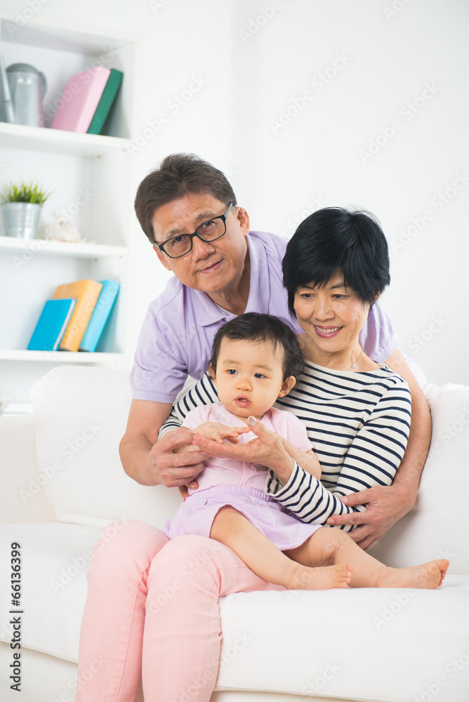 chinese grandparents with granddaugther with life style backgrou chinese grandparents with granddaugther with life style backgrou