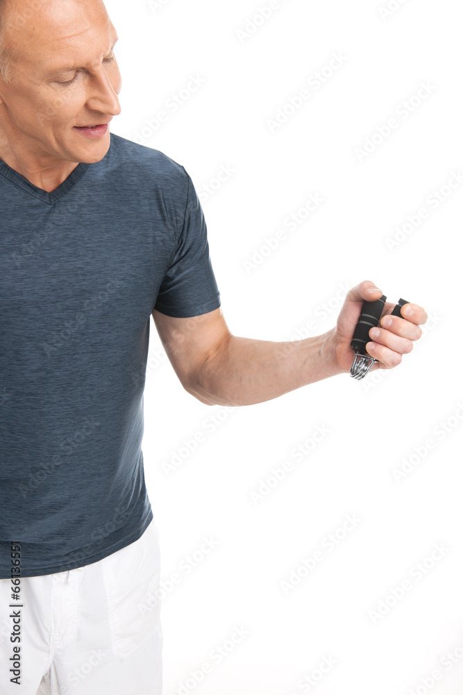 Hand holding gripper on white background. Hand holding gripper on white background.