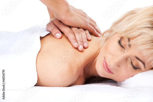 blond woman lying in spa and smiling.