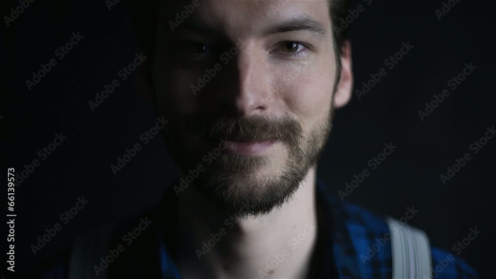 Hipster in checkered shirt isolated on black background Hipster in checkered shirt isolated on black background