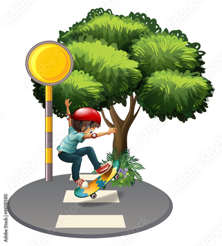 A young gentleman playing at the pedestrian lane