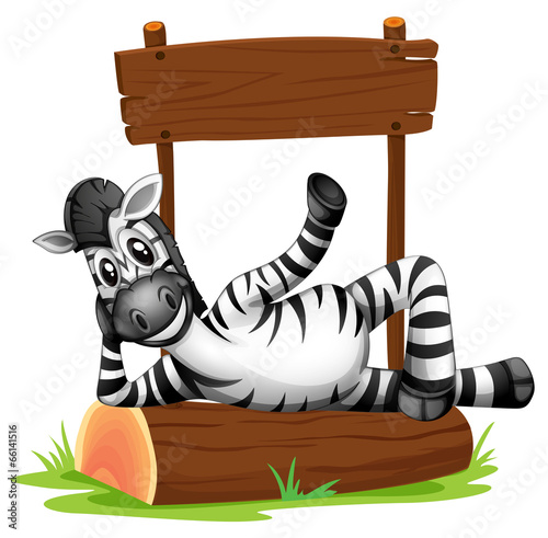 A zebra under the empty signboard