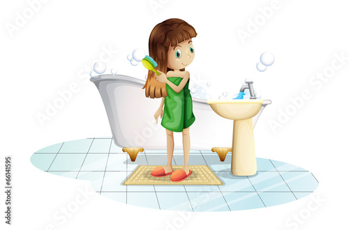 A young lady combing her long hair