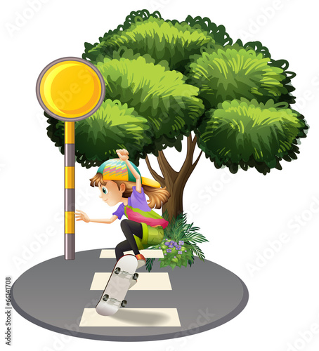 A young girl playing with her skateboard at the street