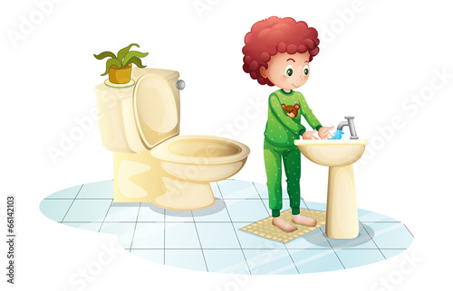 A young man washing his hands
