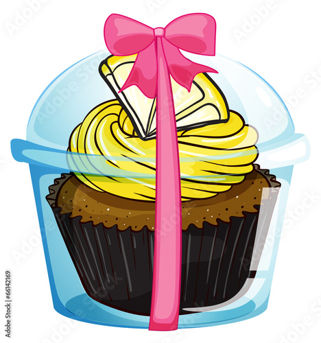 A cupcake with a yellow icing