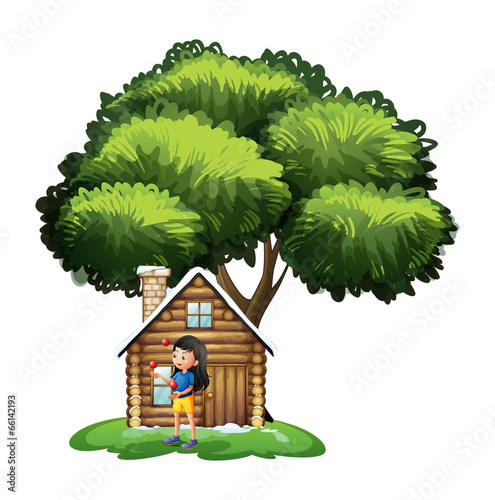 A young girl playing outside the house