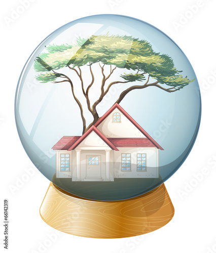 A crystal ball with a house and a tree inside