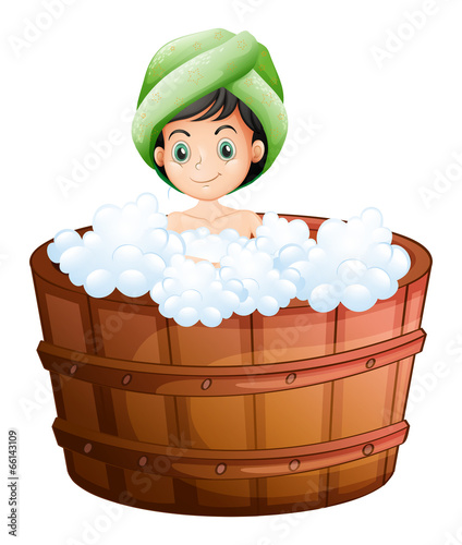 A cute little girl taking a bath