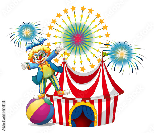 A male clown playing outside the tent