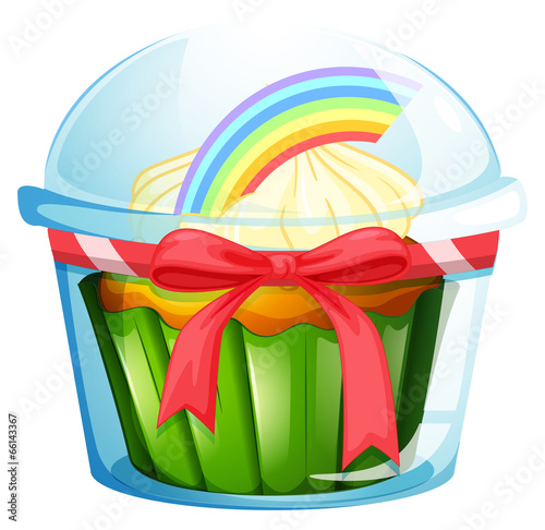 A container with a cupcake inside decorated with a ribbon