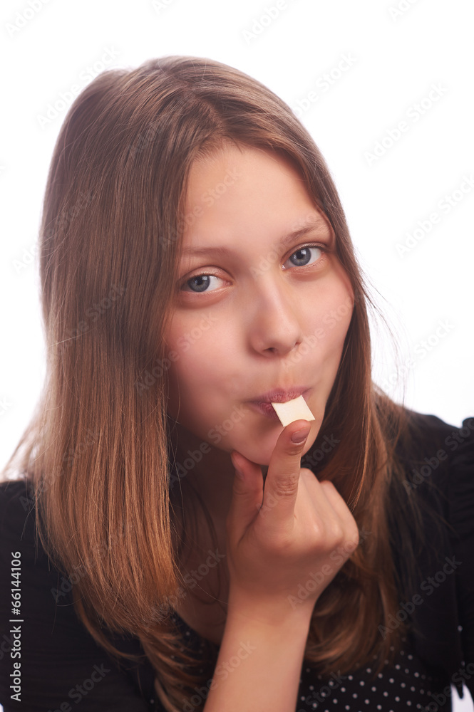 teen girl eating bubblegum on white background teen girl eating bubblegum on white background